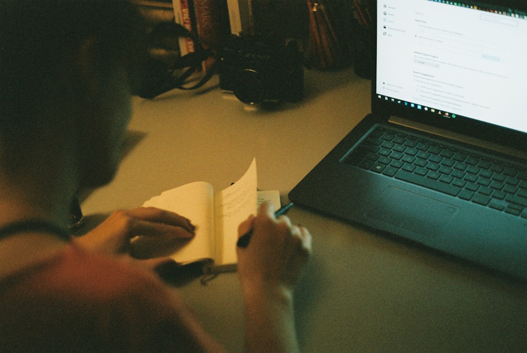developer working laptop notes