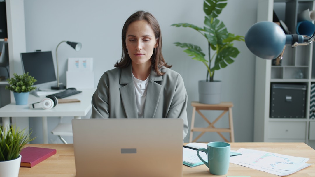 young woman working laptop confident